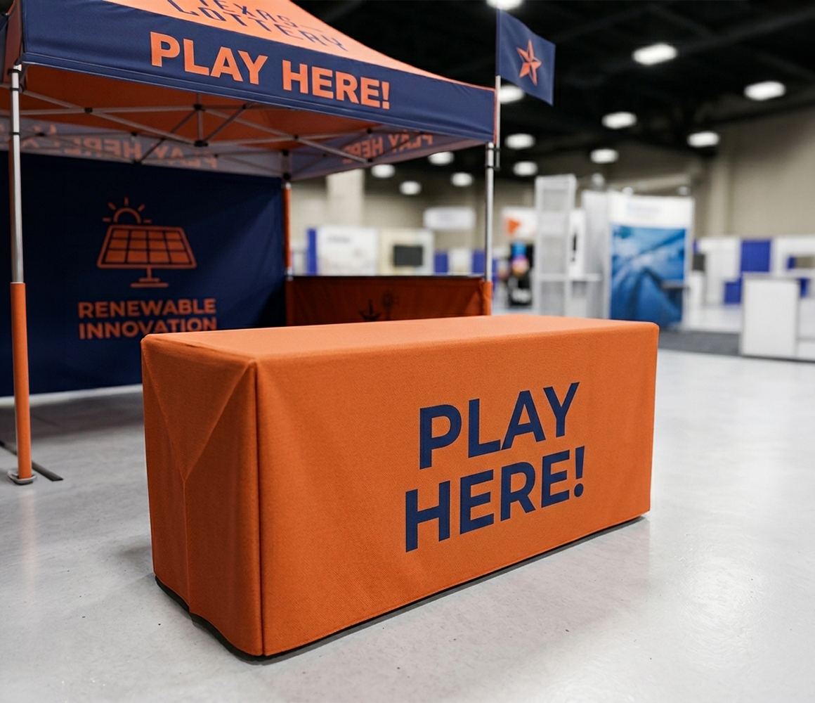Trade show tent paired with a branded table cover for professional presentation.