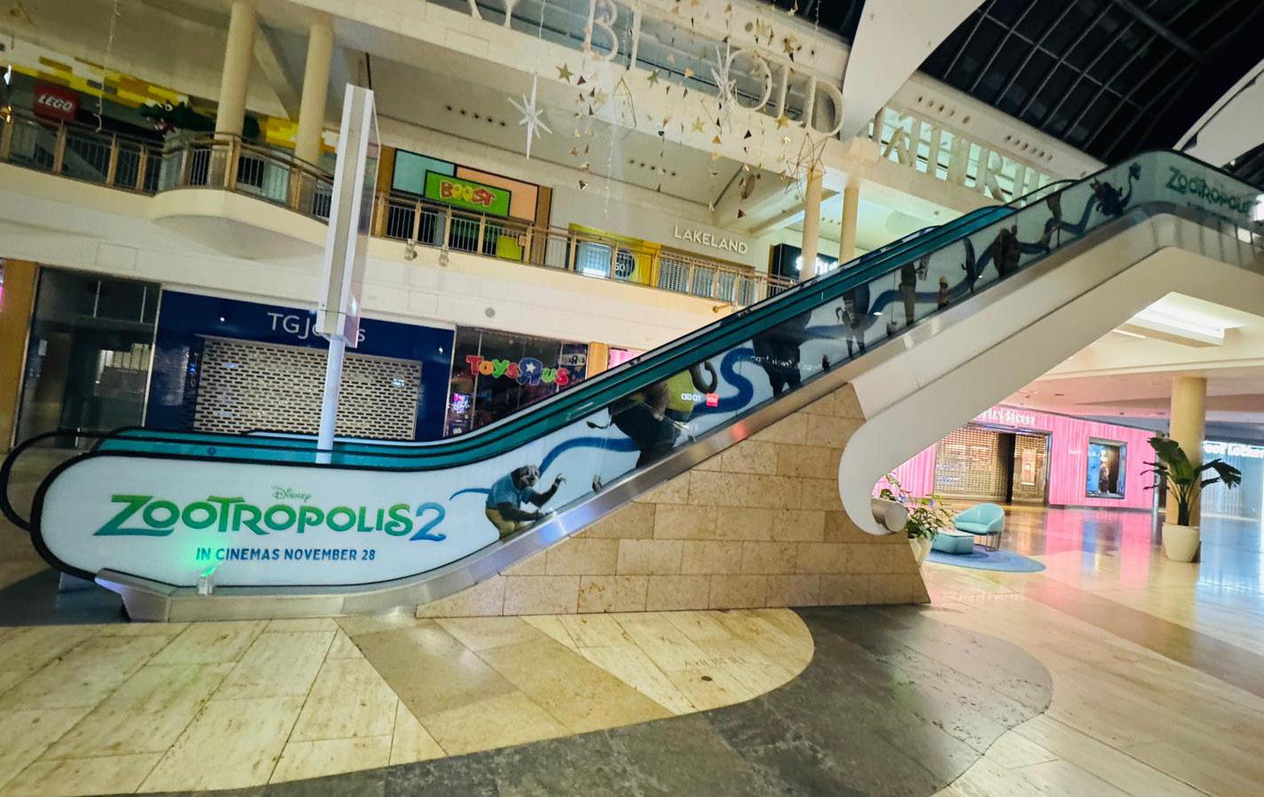 Disney Zootopia 2 escalator graphics installed by ARC UK at Bluewater Shopping Centre creating an immersive retail experience