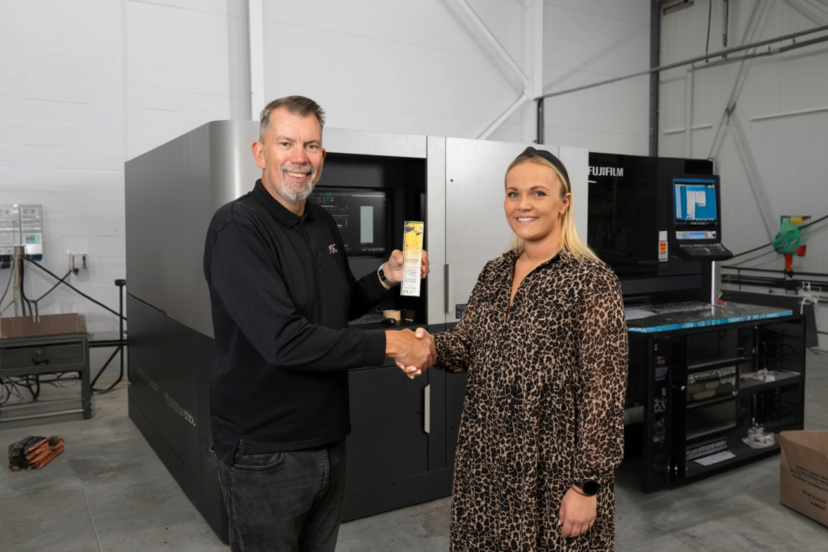 ARC UK team celebrating an award for large format printing