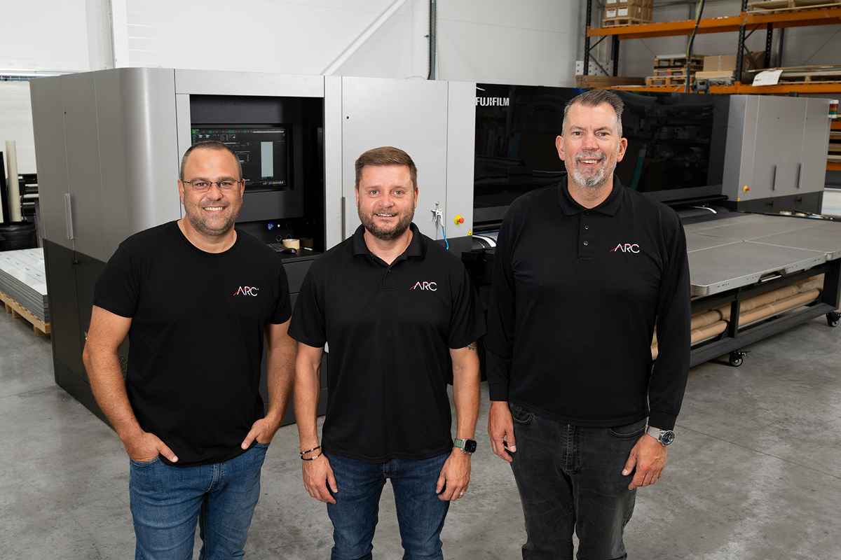 ARC UK employee operating an industrial large format printer